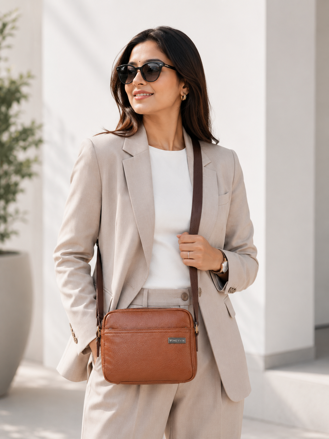 Brown Ladies Sling Bag Worn Crossbody by Woman