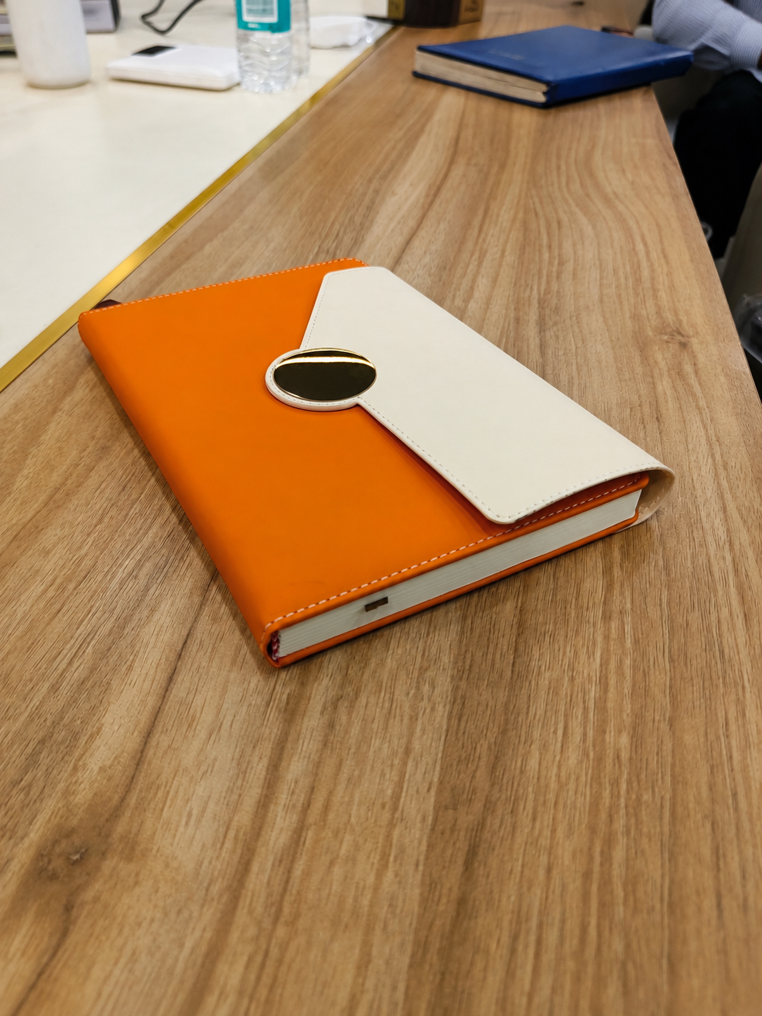 Personalized orange and ivory A5 notebook with magnetic flap closure and custom name