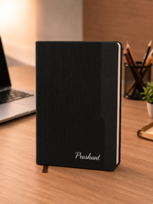 Personalized black A5 notebook with textured cover and custom name
